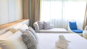 Postel nebo postele na pokoji v ubytování Hiran Residence