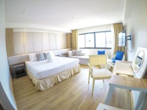 Postel nebo postele na pokoji v ubytování Hiran Residence