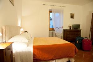 Posteľ alebo postele v izbe v ubytovaní Agriturismo Il Vecchio Portico
