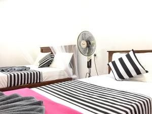 Postel nebo postele na pokoji v ubytování Aroma Heaven Homestay