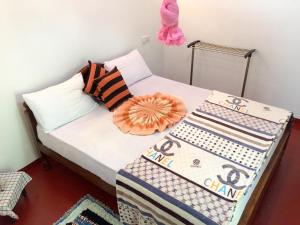 Postel nebo postele na pokoji v ubytování Aroma Heaven Homestay