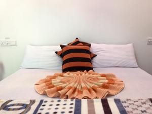 Postel nebo postele na pokoji v ubytování Aroma Heaven Homestay