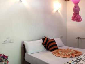 Postel nebo postele na pokoji v ubytování Aroma Heaven Homestay