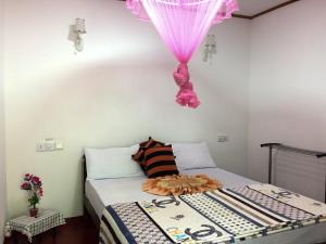 Postel nebo postele na pokoji v ubytování Aroma Heaven Homestay