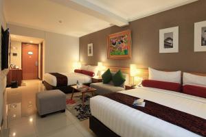 Postel nebo postele na pokoji v ubytování Ivory Hotel Bandung