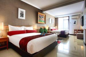 Postel nebo postele na pokoji v ubytování Ivory Hotel Bandung