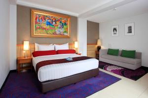 Postel nebo postele na pokoji v ubytování Ivory Hotel Bandung