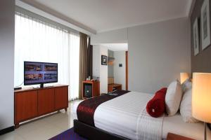 Postel nebo postele na pokoji v ubytování Ivory Hotel Bandung