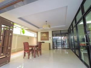 a dining room with a table and chairs at Hiran Residence in Patong Beach