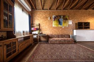a living room with a couch and a table at Healing Hands in Merom Golan +39 photos