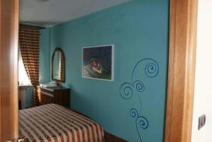 Postel nebo postele na pokoji v ubytování Ristorante Albergo 'l Bunet