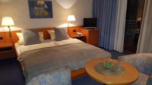 Postel nebo postele na pokoji v ubytování Hotel Vier Linden