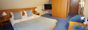 Postel nebo postele na pokoji v ubytování Hotel Vier Linden