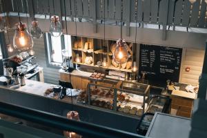 a bakery with a counter with pastries on it at Trysil Hotel in Trysil