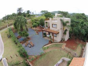 an aerial view of a house with a yard at Terrazzo Suites in Capitólio