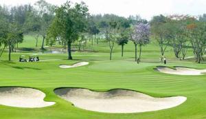 a green golf course with people playing on the greens at View Talay 1B Residence in Pattaya South