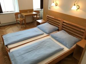 Postel nebo postele na pokoji v ubytování Hotel Pribitzer