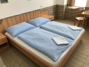 Postel nebo postele na pokoji v ubytování Hotel Pribitzer + 13 fotografií