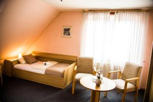 Postel nebo postele na pokoji v ubytování Hotel Stadt Peine