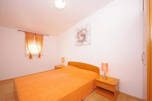 Postel nebo postele na pokoji v ubytování Apartments Bartulić