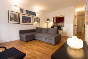 a living room with a couch and a table at Typical Tailor Made Flat in Central Graça in Lisbon