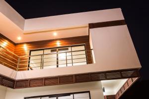 a house with a large window on the side of it at Sargas Villa, Saint Lucia in Colombette