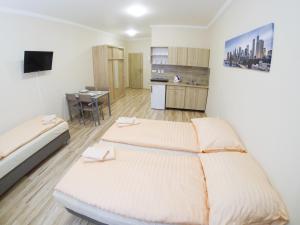 Posteľ alebo postele v izbe v ubytovaní Apartmány ORAVA-EDDA