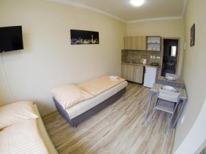 Kuchyňa alebo kuchynka v ubytovaní Apartmány ORAVA-EDDA