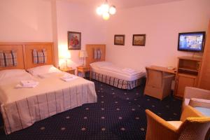 Posteľ alebo postele v izbe v ubytovaní Hotel Klika