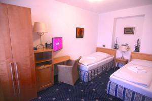 Posteľ alebo postele v izbe v ubytovaní Hotel Klika