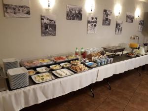 a buffet table with many different types of food on it at Résidence Tournet in Krakow +65 photos