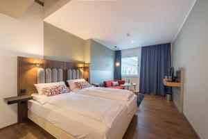 Łóżko lub łóżka w pokoju w obiekcie Hotel Ploberger