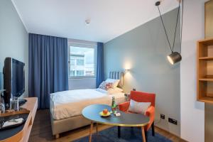 Łóżko lub łóżka w pokoju w obiekcie Hotel Ploberger