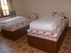 Postel nebo postele na pokoji v ubytování SUBI Home Stay