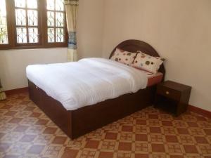 SUBI Home Stay tesisinde bir odada yatak veya yataklar