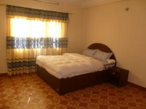 Postel nebo postele na pokoji v ubytování SUBI Home Stay