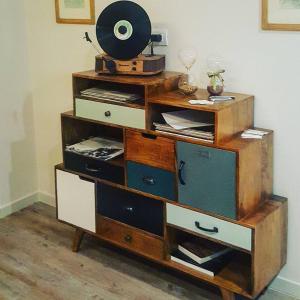 a wooden dresser with a fan on top of it at B&B Parini in Cassino