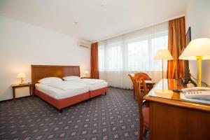 Letto o letti in una camera di Parkhotel Styria