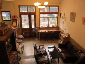 a living room with a couch and a table at Shennong 147 in Tainan