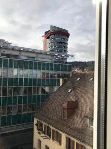 a view of a tall building with a roof at My Home Location in La Chaux-de-Fonds