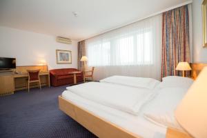 Letto o letti in una camera di Parkhotel Styria
