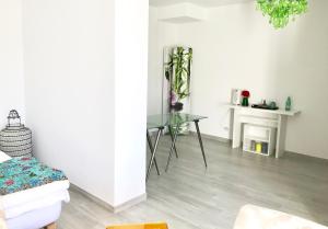 a living room with a glass table and a fireplace at Lakescape Zurich in Herrliberg