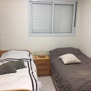 Postel nebo postele na pokoji v ubytování Cobertura Florianopolis itacorubi + 41 fotografií