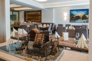 a dining room with a table and chairs at Hotel Restaurant Sailer in Seewalchen