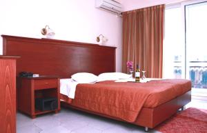 Postel nebo postele na pokoji v ubytování Apollo Hotel