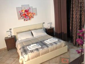 En eller flere senge i et værelse på B&B Villa Loriana