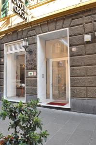 a store front with two windows and a door at Hotel Nuovo Nord in Genova