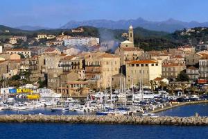 a group of boats in a harbor in a city at CasaRadriimas, un cocon au cœur du Centre Ville in Propriano