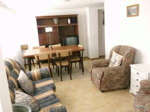 a living room with a dining room table and chairs at Casa Glória in Tomar