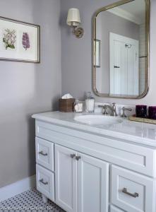 a bathroom with a white sink and a mirror at Stagecoach Inn in Goshen